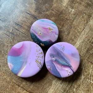Three hand crafted multi colored magnets